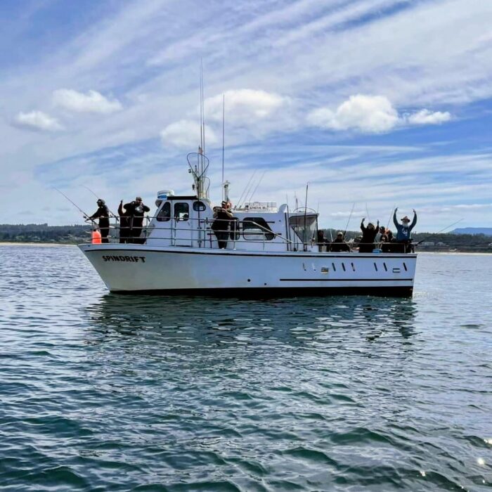Charter boat Spindrift out fishing with excited passengers on board